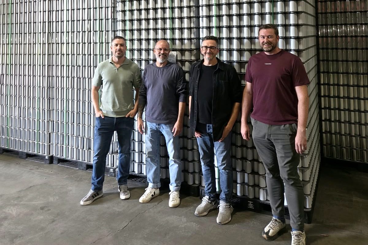Swaay co-founders Mark O'Donnell, Jean-François Gaudreault, Sébastien Baril and Ciarán Gorman in front of pallets of blank aluminium cans